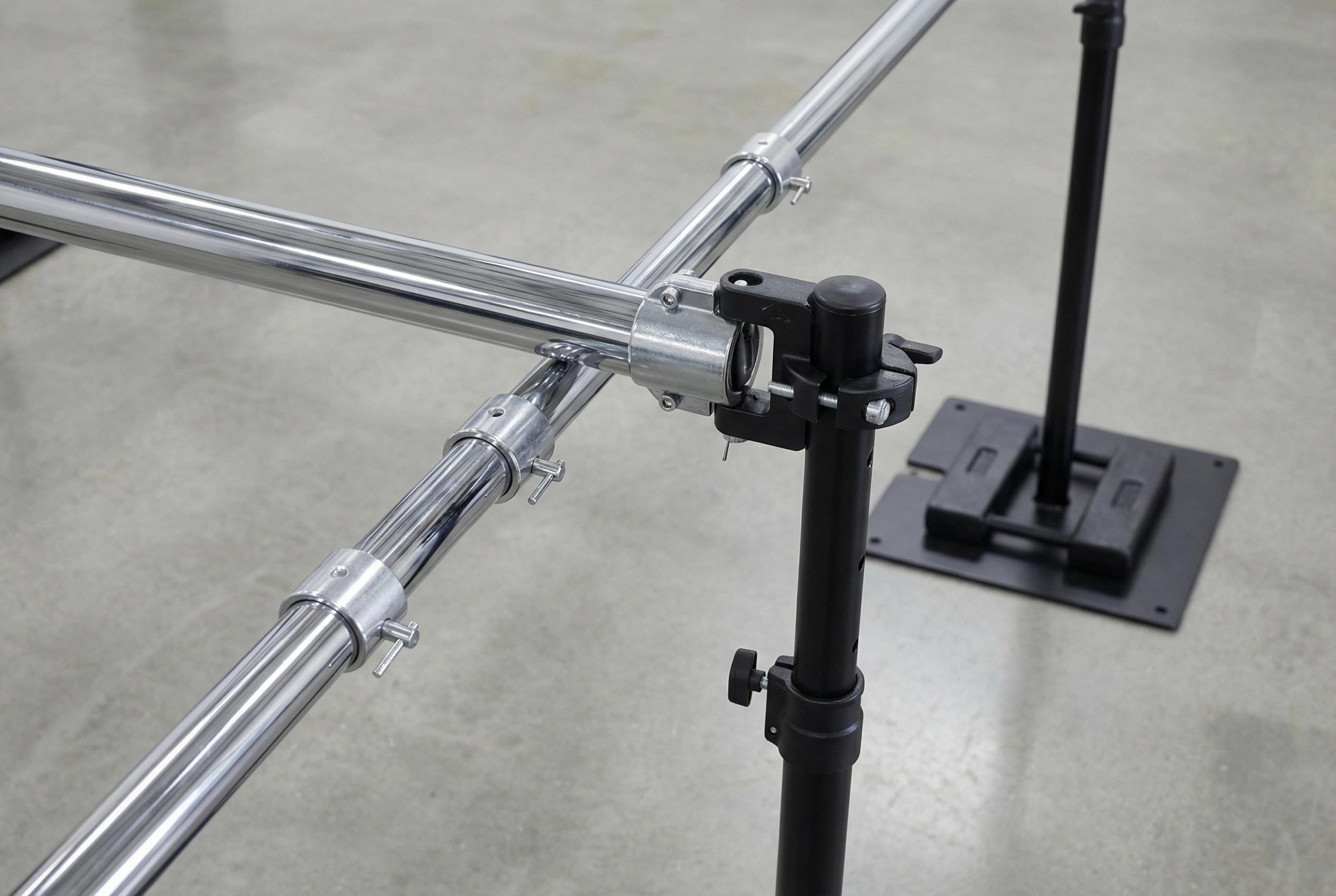 Pipe and base system with crossbars set up in a large event venue